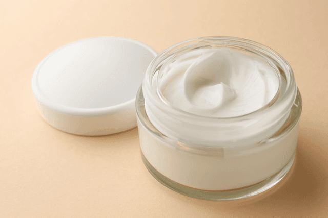 Smooth skincare texture in a glass jar